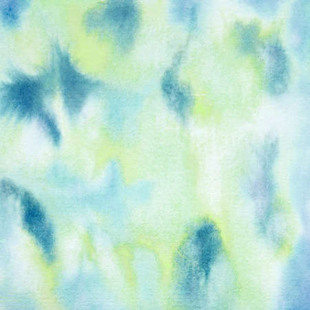 Abstract pattern watercolor background yellow blue shades with ivory and teal as well in this handpainted paint texture pattern.の写真素材
