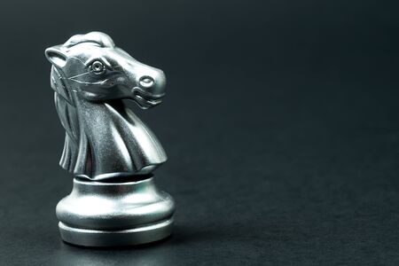 single silver knight chess on black backgroundの写真素材