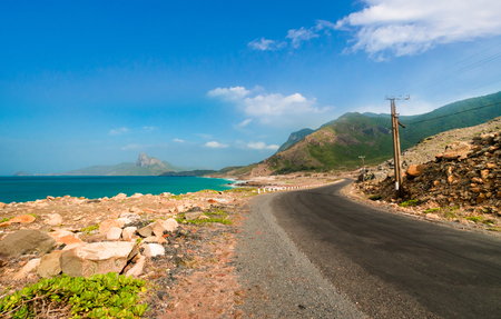 Road along the turquoise sea white sand and rocky under sunshine very beautiful nature at Bai nhat beach Condao island - Vietnam.の写真素材