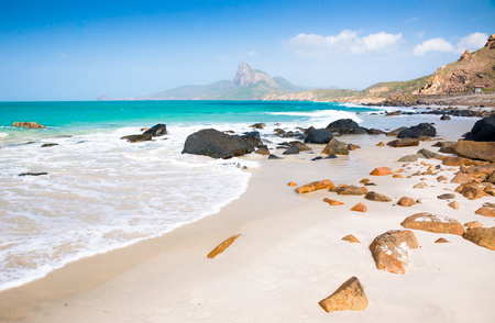 turquoise sea white sand and rocky under sunshine very beautiful nature at Bai nhat beach Condao island - Vietnam.の写真素材