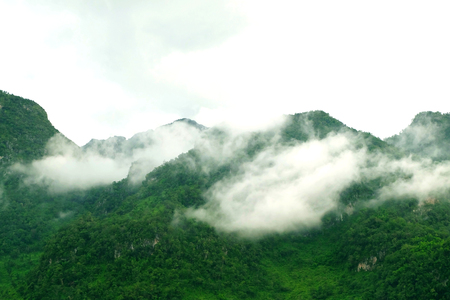 View of misty fog mountains in winter of Thailand.の写真素材