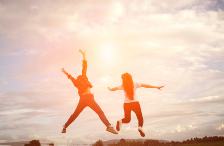 silhouette of a happy human and happy time sunset (Soft focus)の写真素材