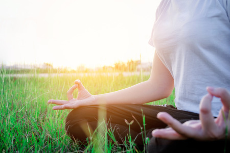 Yoga woman in the lotus posture Exercises Outdoorの写真素材