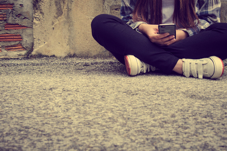 young hipster woman using smart phoneの写真素材