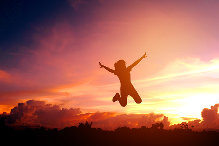 Silhouette young woman Enjoy and  Happyの写真素材