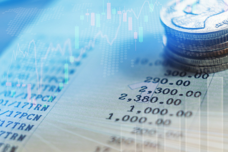 graph on rows of coins for finance and banking conceptの写真素材