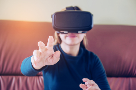 Woman wearing virtual reality glassesの写真素材