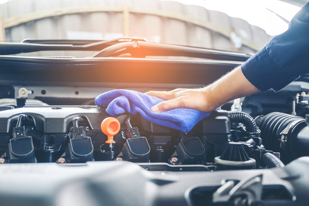 Auto mechanic repair engine in a car repairの写真素材