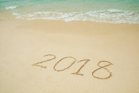 New Year 2018 is coming 2018 on a beach sand, the waveの写真素材