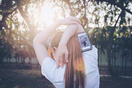 Women exercising in sunny bright light.in parkの写真素材