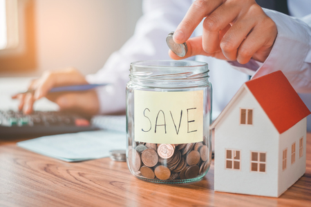 Savings, finances calculator counting money for Home conceptの写真素材