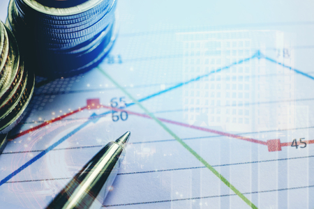 Pen and coin on the business paper. Report chartの写真素材