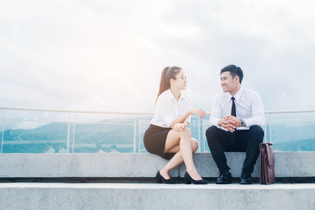 Asian Business people talking outside office after workの写真素材
