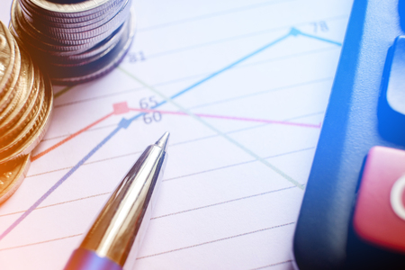Pen,coin on the business paper and Calculator Report chartの写真素材