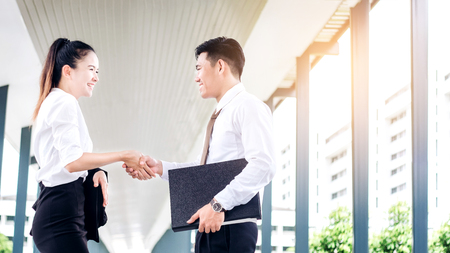 Business partnership handshaking after striking deal outdoors at meetingの写真素材