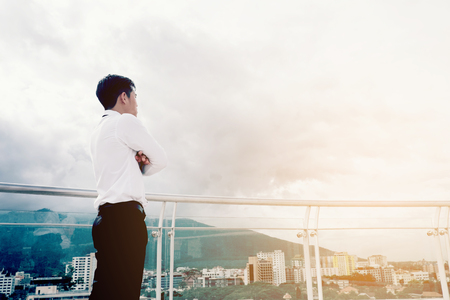 Back view of success Business man looking view the cityの写真素材