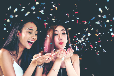 celebration party group of asian young woman and confetti happy,funny conceptの写真素材