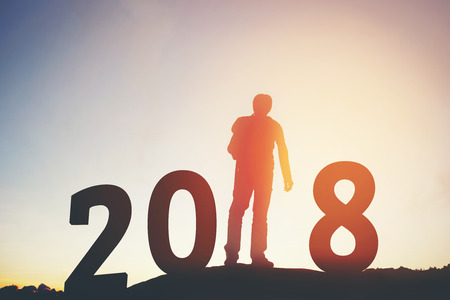 Silhouette of Traveler man Happy for 2018 new yearの写真素材