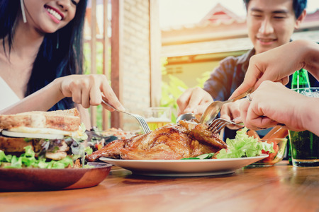 Group Friends young asian people Party and eating food happy enjoying in homeの写真素材