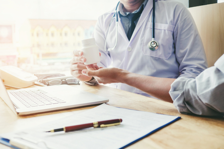 Doctor or physician recommend pills medical prescription to male Patient Doctor or physician recommend pills medical prescription to male Patientの写真素材