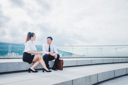 Asian Business people talking outside office after workの写真素材