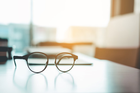 Eye Glasses on the study table education conceptの写真素材