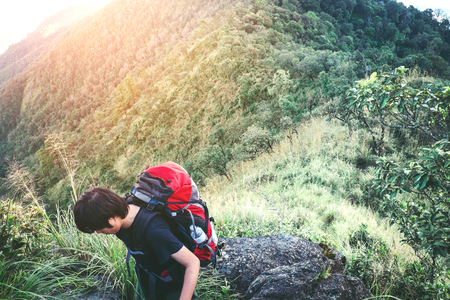 Tourist and Traveler Man with backpack the mountain in forestの写真素材