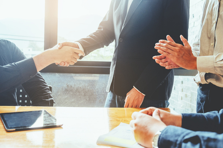 Business people colleagues shaking hands meeting Planning Strategy Analysis Conceptの写真素材