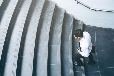 Successful businessman running fast upstairs Success conceptの写真素材