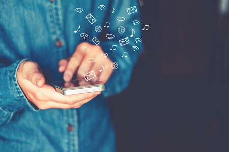 Businessman using mobile online icon social networking connection on screenの写真素材