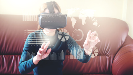 Woman Using 3-D glasses in virtual reality glasses or headsetの写真素材