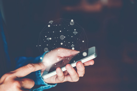 Businessman using mobile online icon social networking connection on screenの写真素材