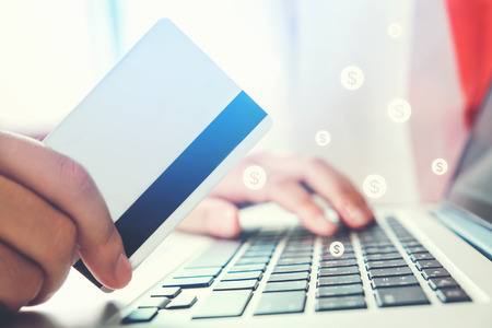 Online banking businessman using Laptop with credit card Fintech and Blockchain conceptの写真素材