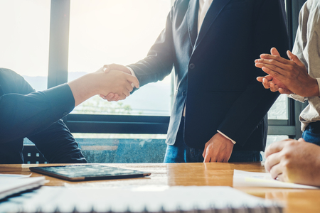 Business people colleagues shaking hands meeting Planning Strategy Analysis Conceptの写真素材