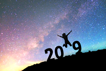 Silhouette young woman Happy for 2019 new year background on  the Milky Way galaxyの写真素材