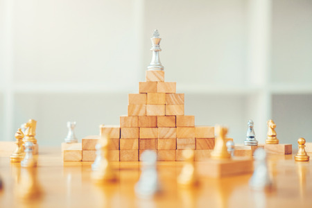 Business leadership concept,chess game on wood game business strategy leader for successの写真素材