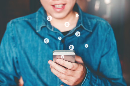 Online banking businessman using smartphone Fintech and Blockchain conceptの写真素材