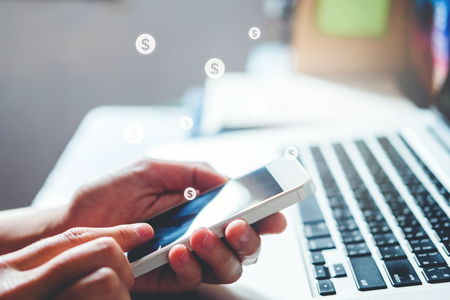 Online banking businessman using smartphone Fintech and Blockchain conceptの写真素材