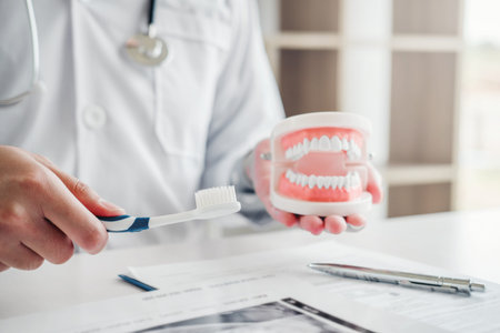 Dentist learning how to brush teeth