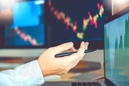 Businessmen trading stocks online Investment discussing and analysis graph stock market...