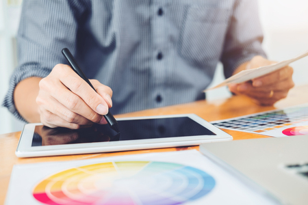 Graphic designer Brainstorming drawing on graphics tablet at workplaceの写真素材