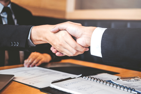 Business people greeting new colleagues while job interviewing shaking hands meeting Planning after during job interview Conceptの写真素材