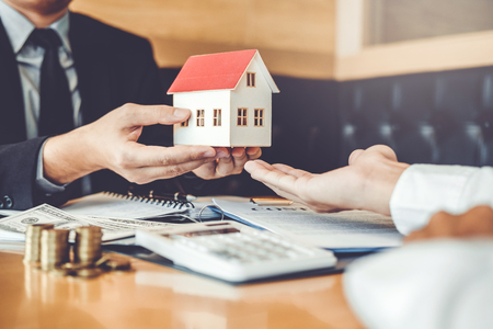 Sale agent giving house to customer Dealing and sign agreement contract, Insurance Home conceptの写真素材