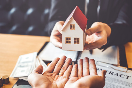 Sale agent giving house to customer Dealing and sign agreement contract, Insurance Home conceptの写真素材