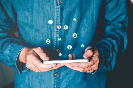 Online banking businessman using smartphone with credit card Fintech and Blockchain conceptの写真素材
