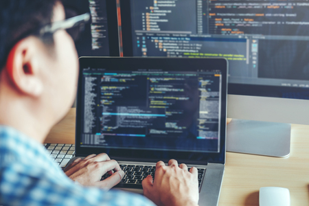 Developing programmer Development Website design and coding technologies working in software company officeの写真素材