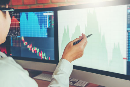 Business Man Investment discussing and analysis graph stock market trading,stock chart conceptの写真素材