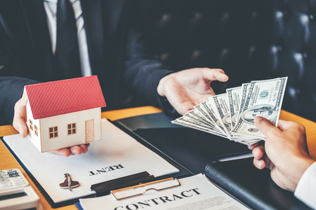 Sale agent giving house to customer Dealing and sign agreement contract, Insurance Home conceptの写真素材