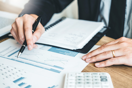Business man Accounting Calculating Cost Economic budget investment and saving conceptの写真素材