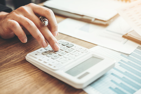 Business man Accounting Calculating Cost Economic budget investment and saving conceptの写真素材